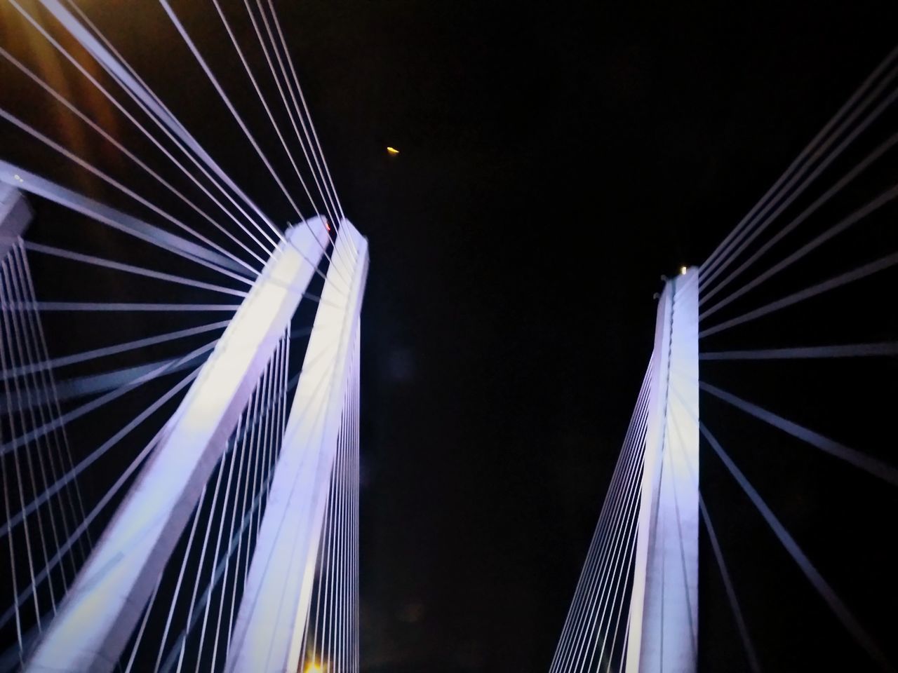 LOW ANGLE VIEW OF FERRIS WHEEL AGAINST SKY AT NIGHT