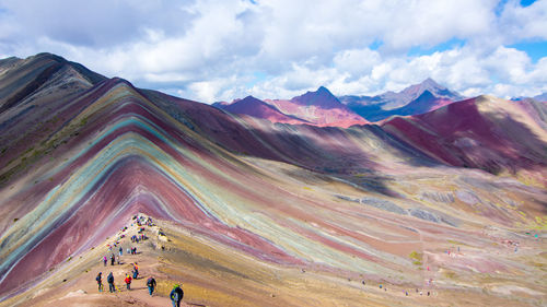 Scenic view of mountains against cloudy sky