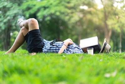 Full length of man lying on grass