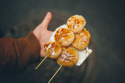 Close-up of hand holding sweet food