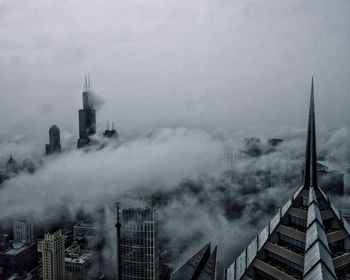 Panoramic shot of buildings in city against sky