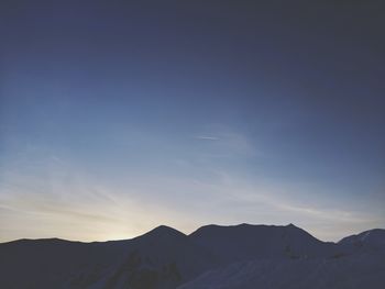 Scenic view of mountains against sky during sunset