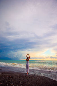 Rear view of man standing on beach