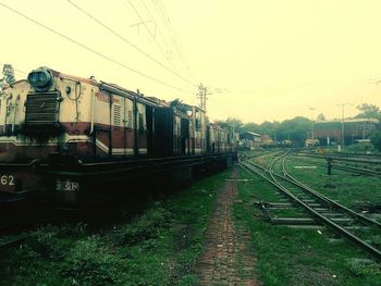 Train on railroad track against sky