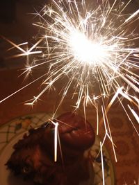 Close-up of firework display at night