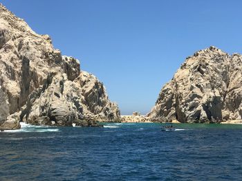 Scenic view of sea against clear blue sky