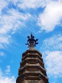 Low angle view of statue against blue sky