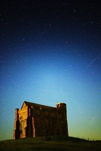 Low angle view of built structure at night