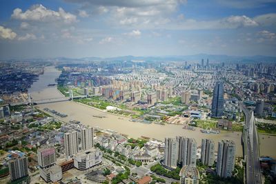 High angle view of river in city against sky