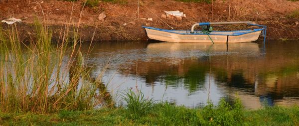 Boat moored in lake