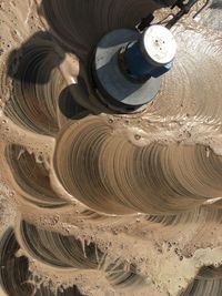 High angle view of mud on sand