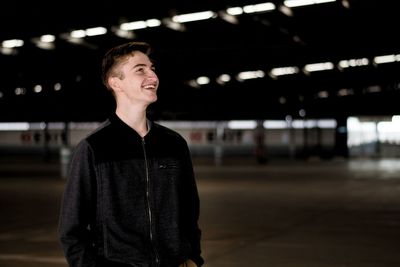 Portrait of young man standing outdoors