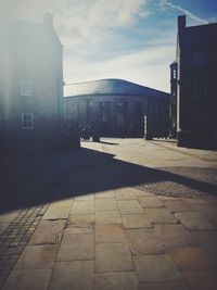 Buildings in city against sky