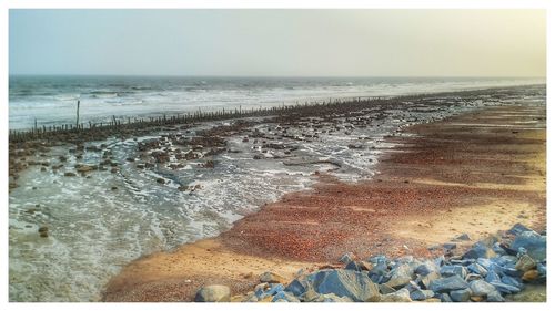 Scenic view of beach against sky