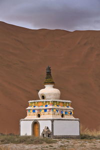 View of temple on building against sky