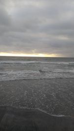 Scenic view of sea against cloudy sky