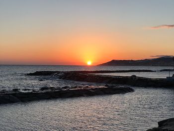 Scenic view of sea against sky during sunset