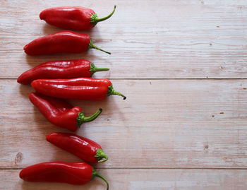 High angle view of red chili peppers on table
