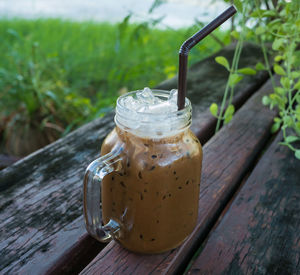 Close-up of drink in glass jar on table