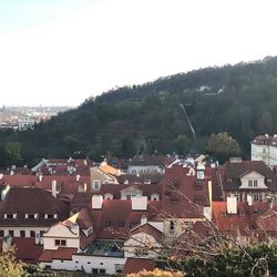 Houses in city against clear sky