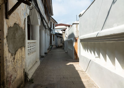 Alley amidst buildings in city