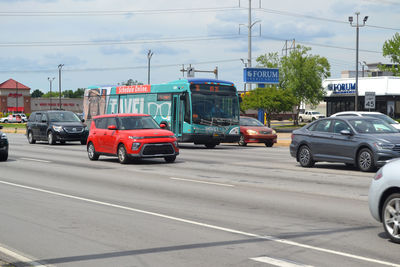 Vehicles on road along buildings