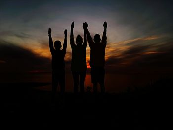 Silhouette people at sunset