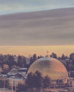Church against cloudy sky during sunset
