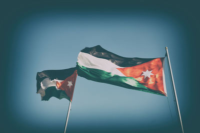 Low angle view of flag against the sky