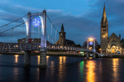 View of illuminated tower bridge at night