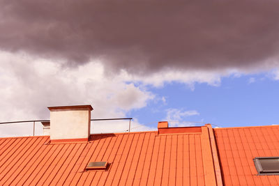 Low angle view of building against cloudy sky