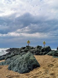 Scenic view of rocks on land against sky