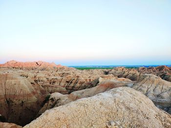 Scenic view of rocks against clear sky