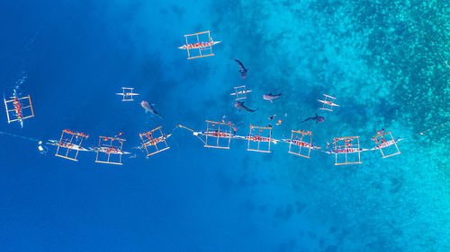 Digital composite image of ship in sea against blue sky