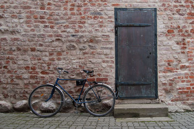 Bicycle against brick wall