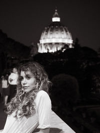 Portrait of woman looking away against sky