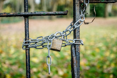 Close-up of padlock on fence