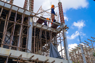 Low angle view of construction site against sky