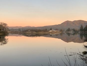 Scenic view of lake against sky during sunset