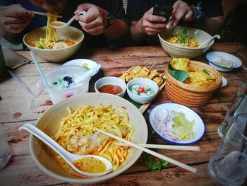 High angle view of person having food on table