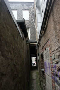 Archway amidst buildings against sky