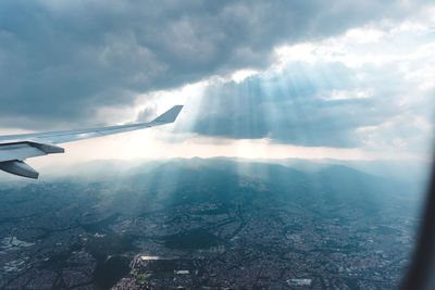 Aerial view of airplane flying in sky