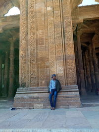 Full length of a buddha statue in a temple