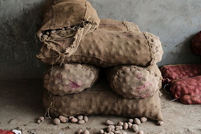 Close-up of bread on table against wall