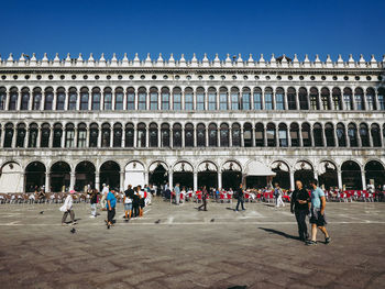 Group of people in front of historical building