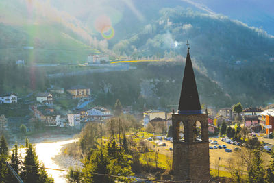 Panoramic view of buildings and mountains against sky