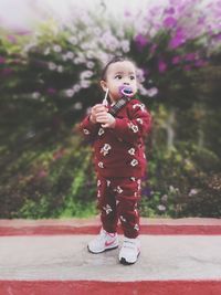 Portrait of cute girl standing outdoors