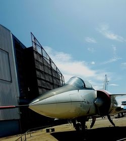 Low angle view of airplane against sky