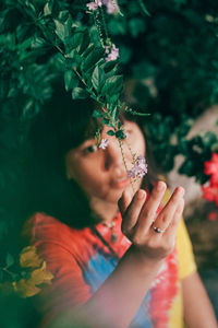 Portrait of woman by plants