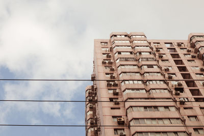 Low angle view of modern building against sky